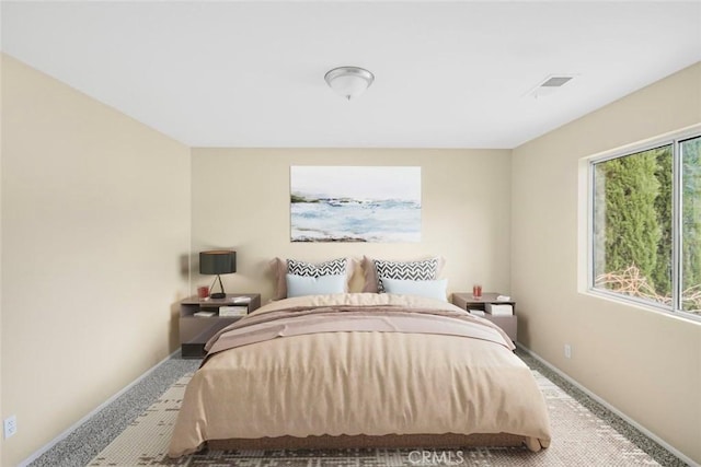 carpeted bedroom with baseboards