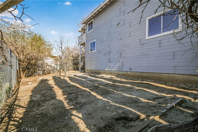 view of side of property with fence