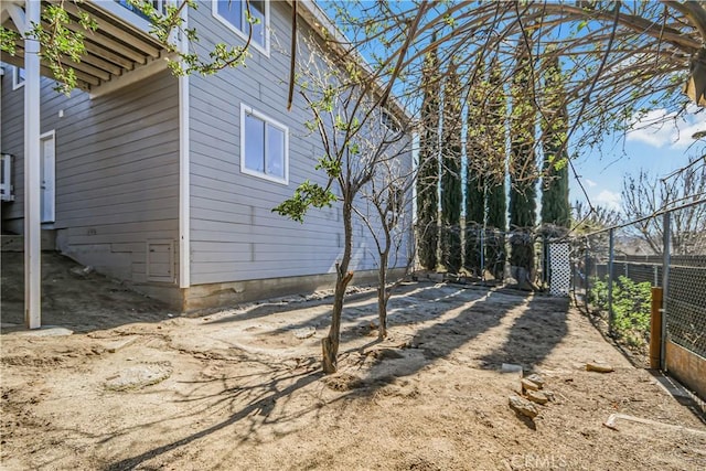 view of property exterior featuring fence