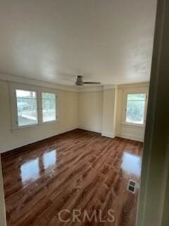 spare room with visible vents and wood finished floors