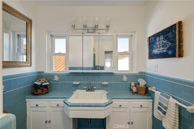 bathroom with tile walls and wainscoting