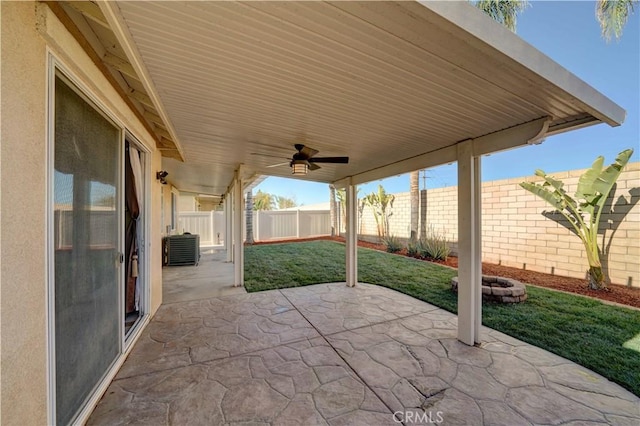 view of patio / terrace with central AC unit, a fenced backyard, and ceiling fan