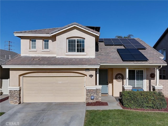 traditional-style house with stone siding, stucco siding, an attached garage, and driveway