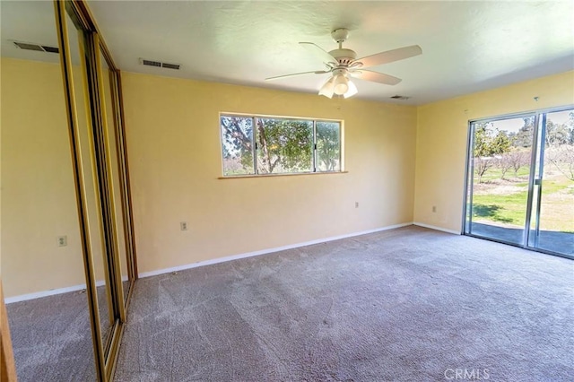 spare room with a wealth of natural light and visible vents