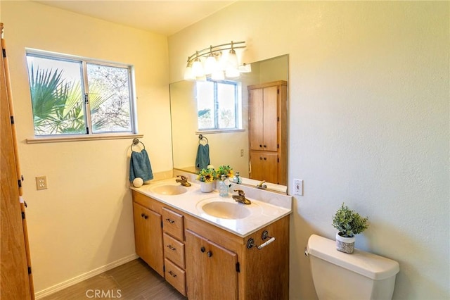 4760 County Rd 99 W, Orland, CA 96963 - bathroom with plenty of natural light, double vanity, toilet, and wood finished floors