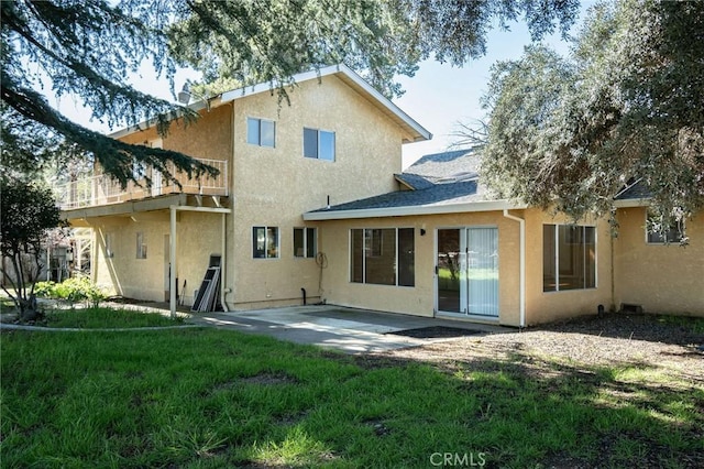 4760 County Rd 99 W, Orland, CA 96963 - rear view of house featuring stucco siding, a patio, and a lawn