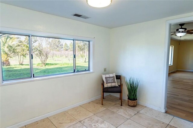 unfurnished room featuring visible vents, baseboards, and light tile patterned flooring