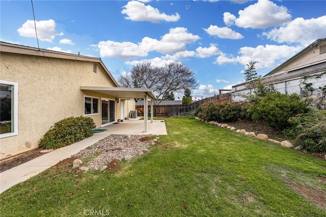 view of yard featuring a patio area and fence