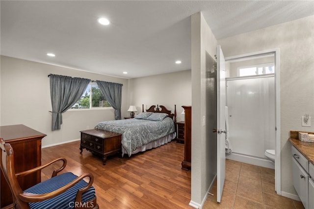 bedroom featuring recessed lighting, baseboards, and wood finished floors