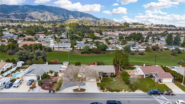 birds eye view of property featuring a mountain view and a residential view