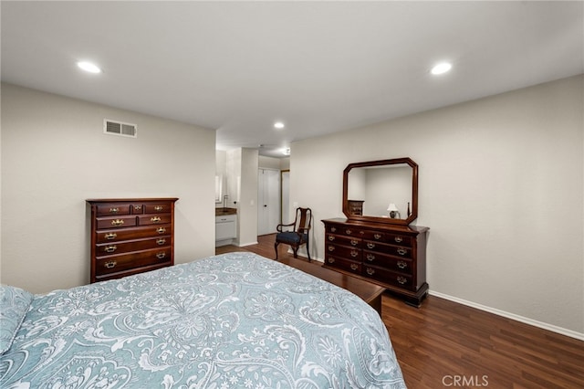 bedroom with recessed lighting, visible vents, baseboards, and wood finished floors