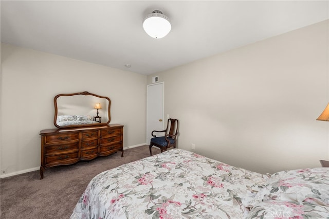 carpeted bedroom featuring visible vents and baseboards