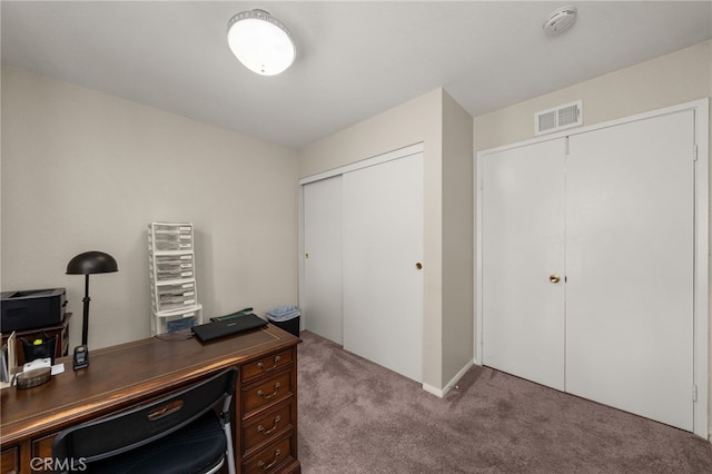 office space featuring visible vents and carpet