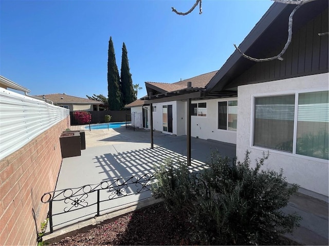 view of patio / terrace with a fenced in pool and a fenced backyard