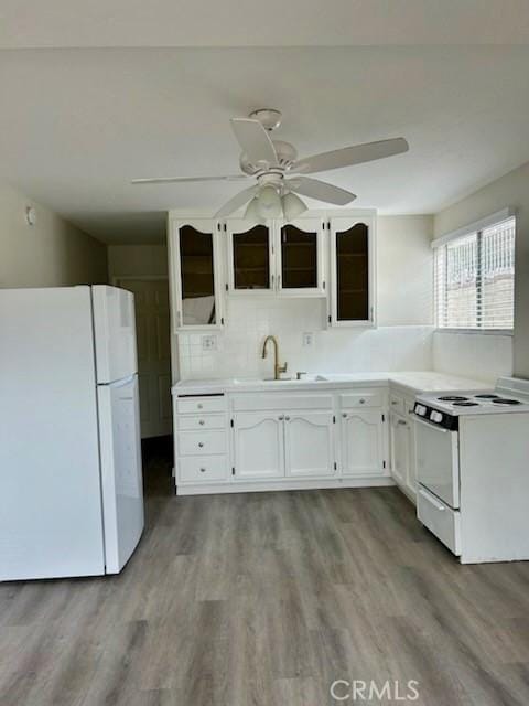 4771 68th St, La Mesa, CA 91942 - kitchen featuring white appliances, white cabinetry, a sink, wood finished floors, and ceiling fan