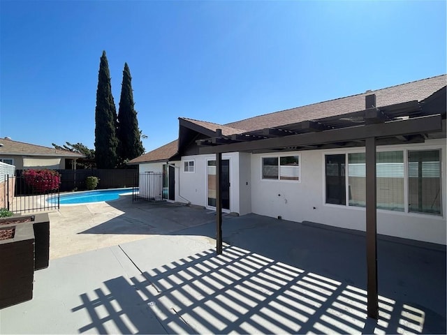 exterior space with a fenced in pool, fence, and a pergola