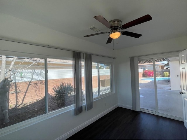 unfurnished sunroom featuring visible vents