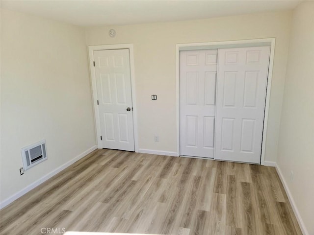 4771 68th St, La Mesa, CA 91942 - unfurnished bedroom with light wood finished floors, a closet, and baseboards