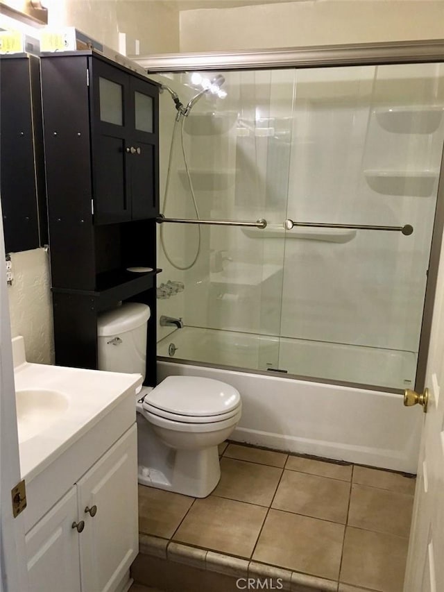 4771 68th St, La Mesa, CA 91942 - bathroom with tile patterned floors, combined bath / shower with glass door, vanity, and toilet