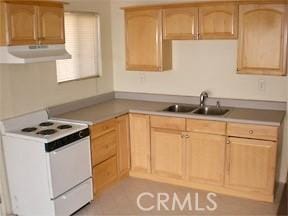 4771 68th St, La Mesa, CA 91942 - kitchen featuring electric stove, under cabinet range hood, light brown cabinets, a sink, and light countertops