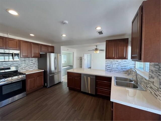 4771 68th St, La Mesa, CA 91942 - kitchen with stainless steel appliances, a sink, backsplash, dark wood-style floors, and recessed lighting