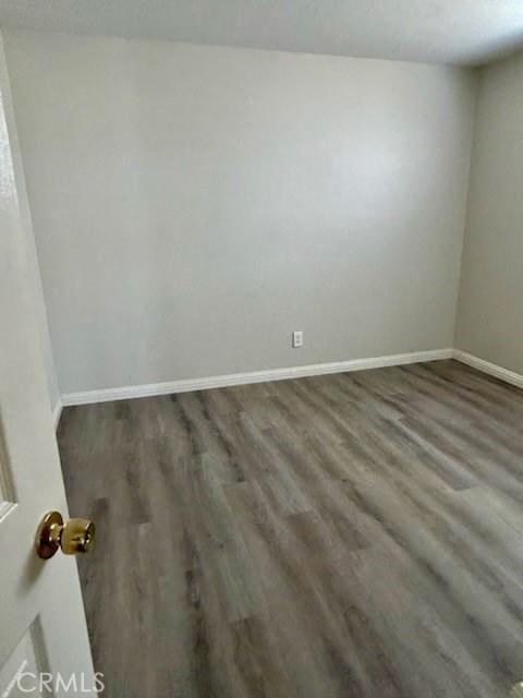 4771 68th St, La Mesa, CA 91942 - empty room featuring wood finished floors and baseboards