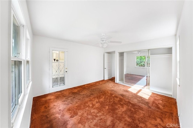 unfurnished bedroom featuring carpet and ceiling fan