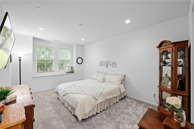 bedroom with light carpet, baseboards, and recessed lighting