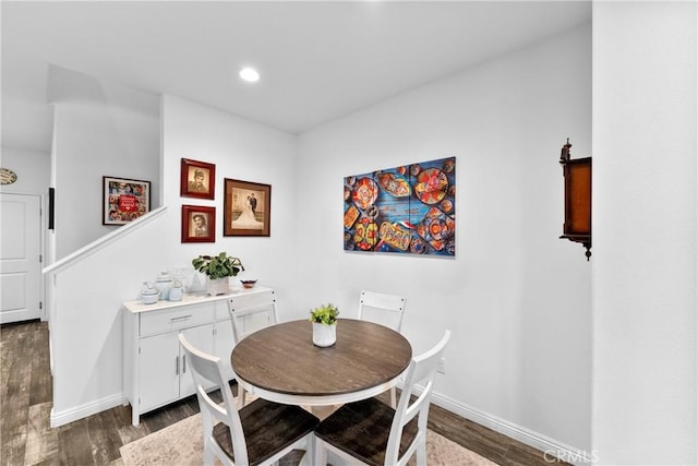 dining area featuring dark wood-type flooring, recessed lighting, and baseboards