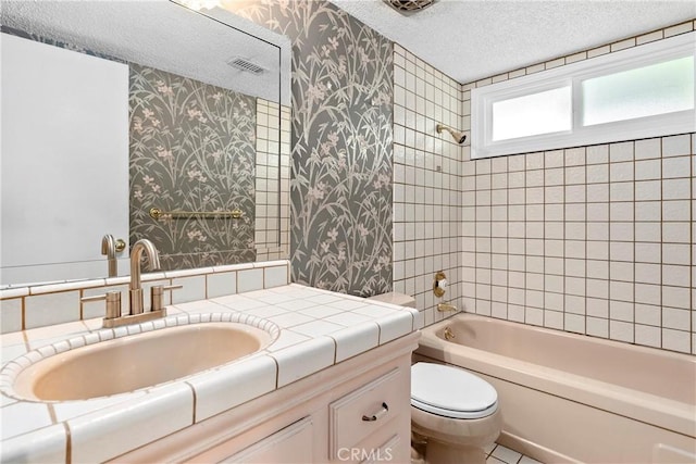 bathroom featuring visible vents, toilet, a textured ceiling, shower / bathing tub combination, and wallpapered walls