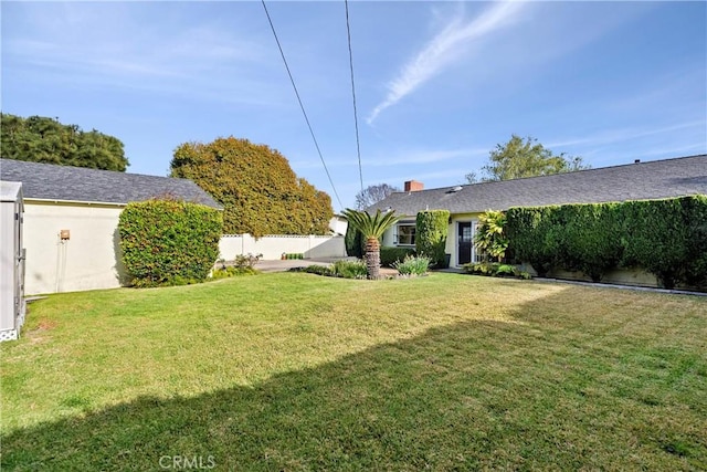 view of yard with fence