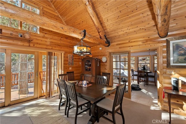 dining space featuring wooden ceiling, plenty of natural light, and beam ceiling