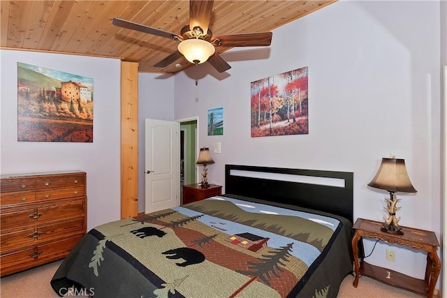 bedroom featuring ceiling fan, carpet flooring, and wood ceiling