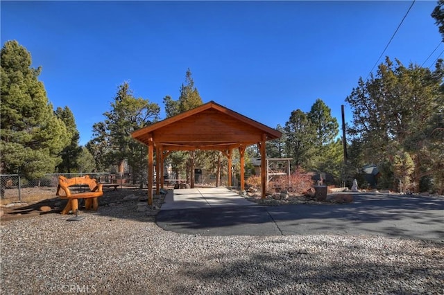 view of home's community featuring a gazebo and fence