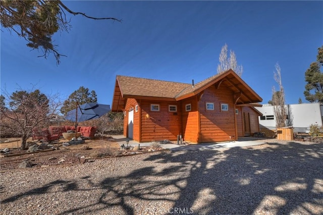 view of front of house featuring a shingled roof