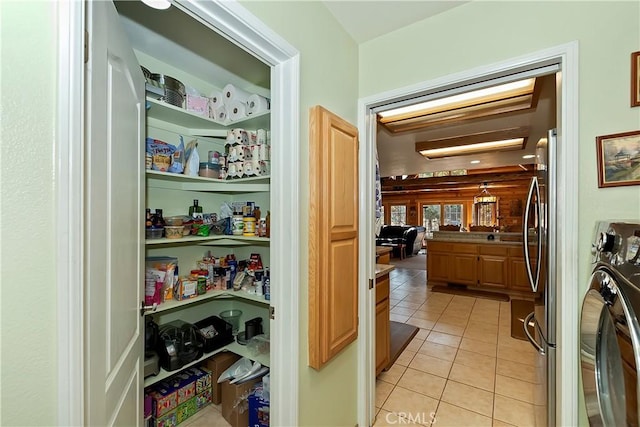 storage area featuring washer / dryer