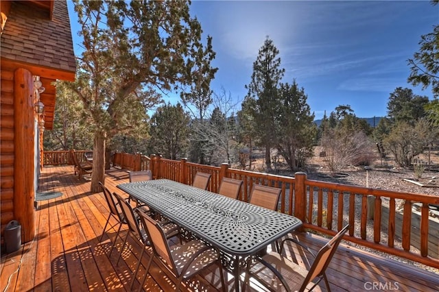 deck featuring outdoor dining area