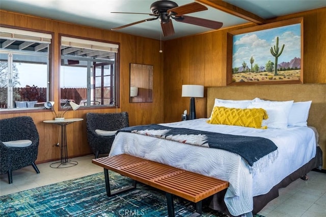 bedroom featuring wooden walls