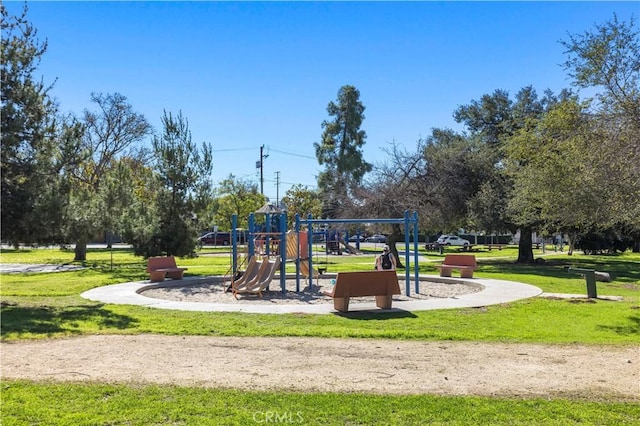 community jungle gym featuring a yard