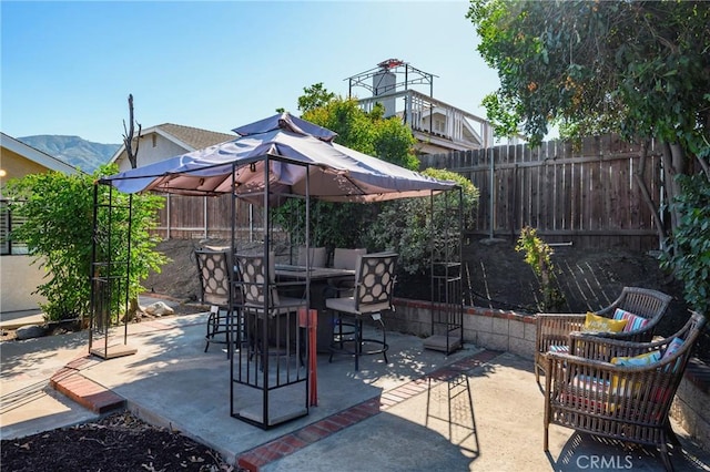 view of patio featuring outdoor dining space and a fenced backyard