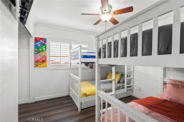 bedroom with a ceiling fan, baseboards, ornamental molding, and wood finished floors