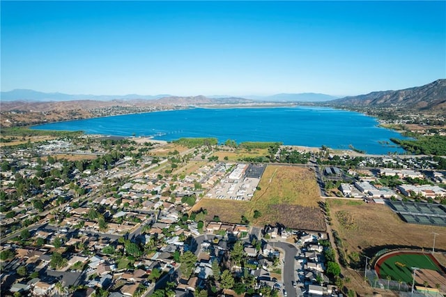 birds eye view of property featuring a water and mountain view