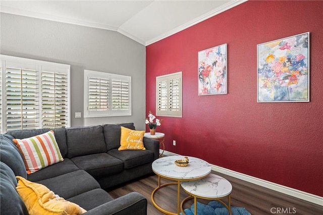 living area with baseboards, ornamental molding, vaulted ceiling, and wood finished floors