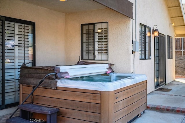 view of patio / terrace featuring a hot tub
