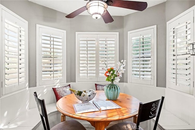dining area featuring ceiling fan and breakfast area