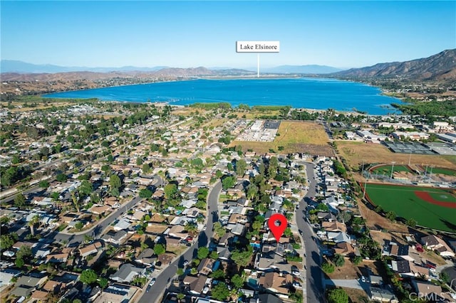 birds eye view of property with a residential view and a water and mountain view