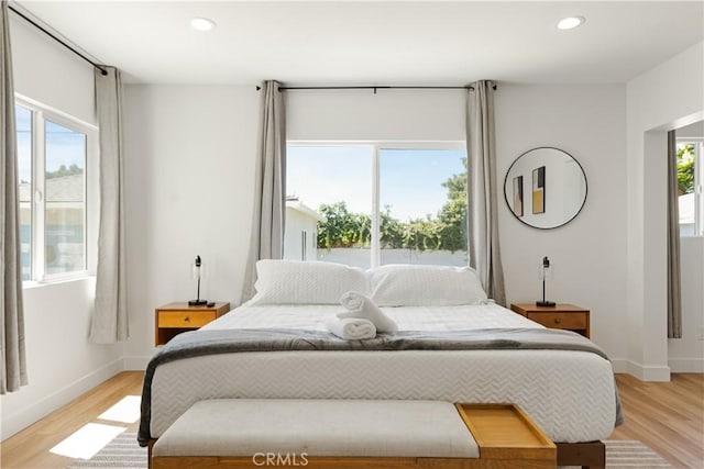 bedroom featuring recessed lighting, baseboards, and light wood-style floors