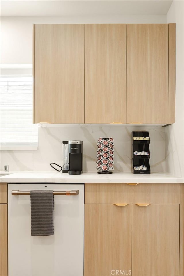 kitchen with modern cabinets and light brown cabinetry