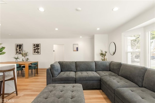 living area featuring recessed lighting and light wood-type flooring