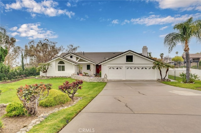 ranch-style home with fence, a tile roof, concrete driveway, a front yard, and an attached garage